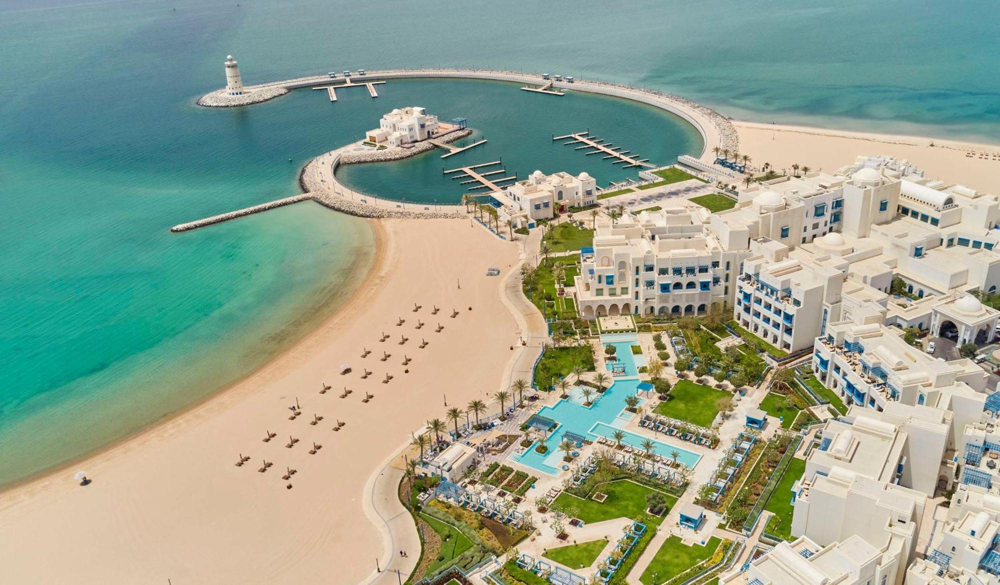 Hilton Salwa Beach Resort And Villas Abu Samra Esterno foto Aerial view of the resort