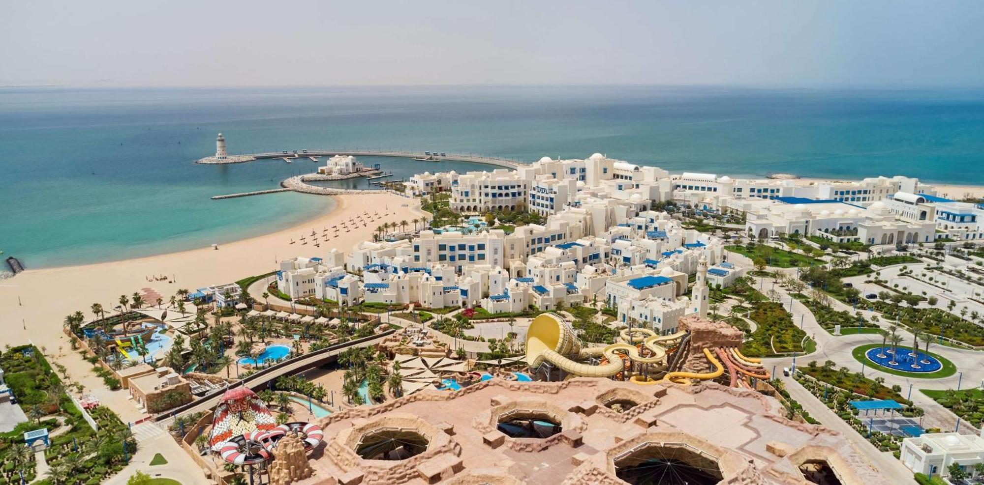 Hilton Salwa Beach Resort And Villas Abu Samra Esterno foto Aerial view of the resort